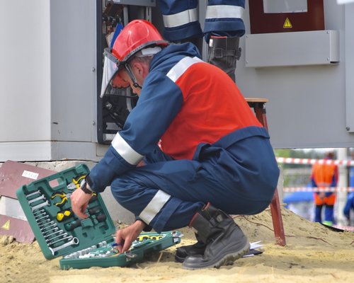 technician preparing tools for an AC maintenance visit